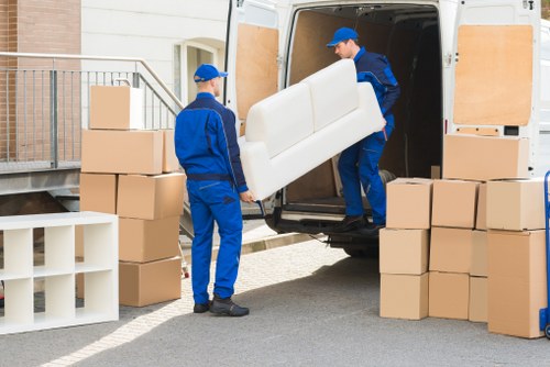 Packed office boxes and furniture ready for relocation