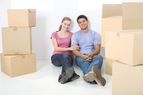 Professional movers handling boxes and furniture in Thamesmead