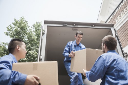 Local moving helper carrying boxes and household items