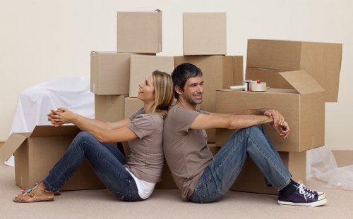 Moving boxes and furniture with a removals van near Thamesmead