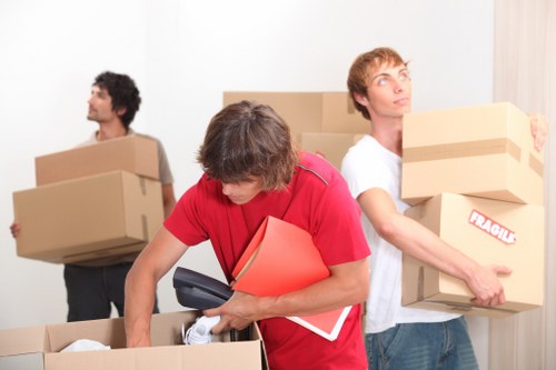 Packed moving boxes and furniture ready for a Thamesmead relocation