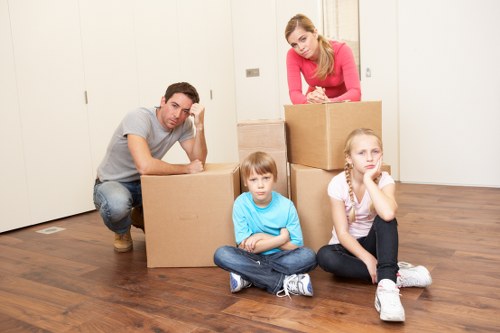 Unpacking boxes in a Thamesmead property after moving day