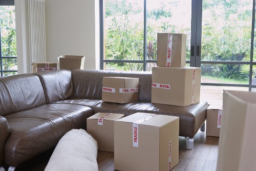 Local movers handling furniture in a Thamesmead apartment block